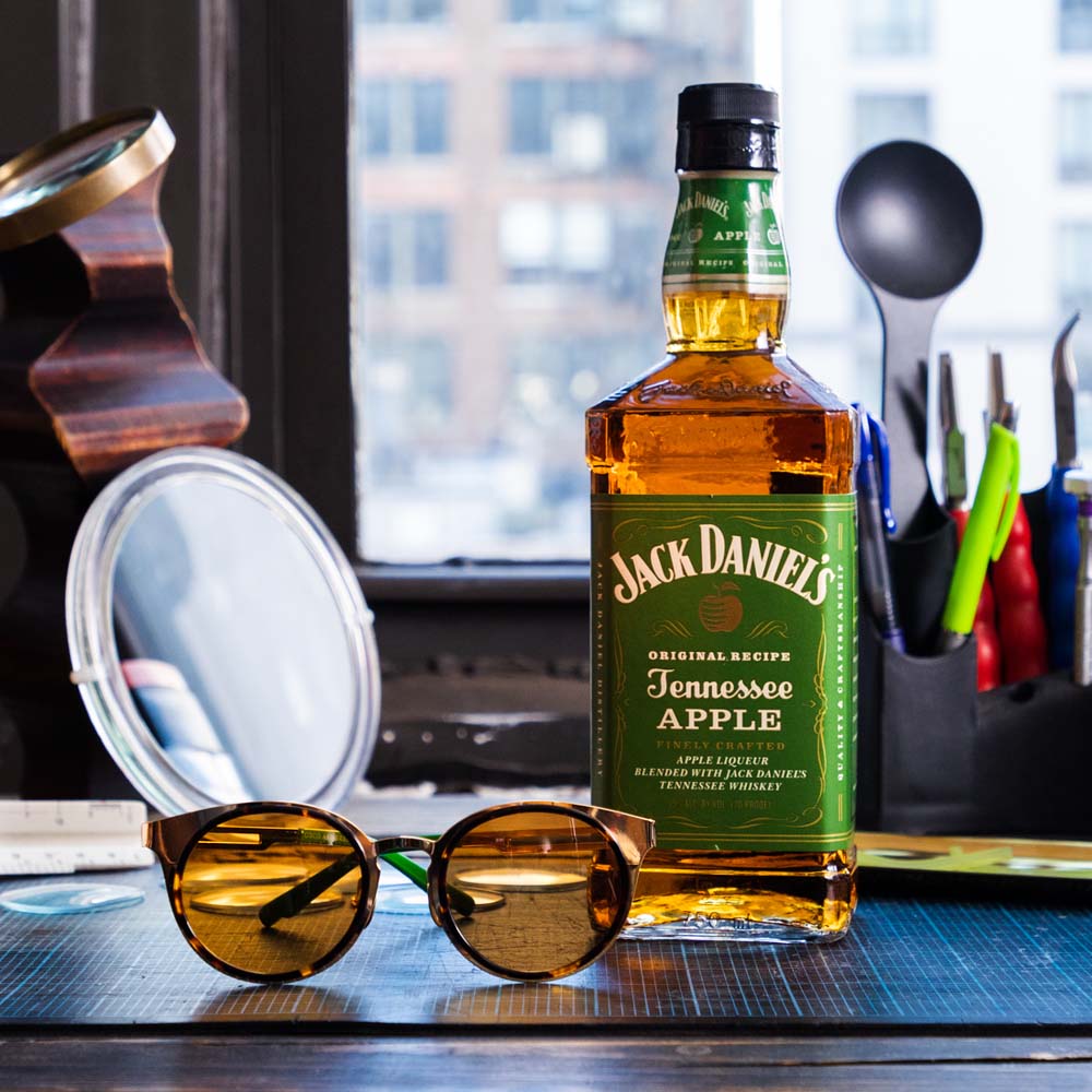 still life image of sunglasses and Jack Daniel's Tennessee Apple